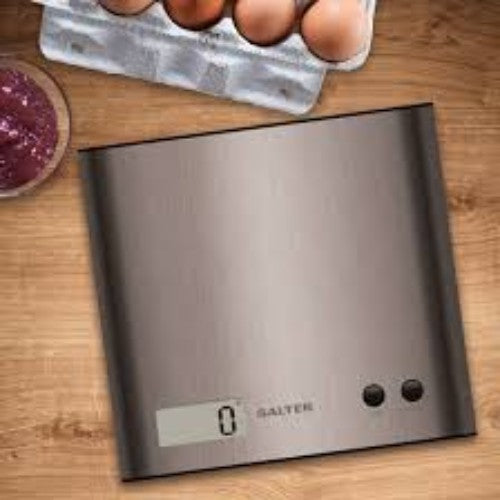 Sleek stainless steel kitchen scale features Add & Weigh, Aquatronic functions, and a large LCD for precise measurements.