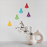 Colorful pop-out jet planes wall art set, crafted in New Zealand, perfect for decorating children's rooms or playrooms.