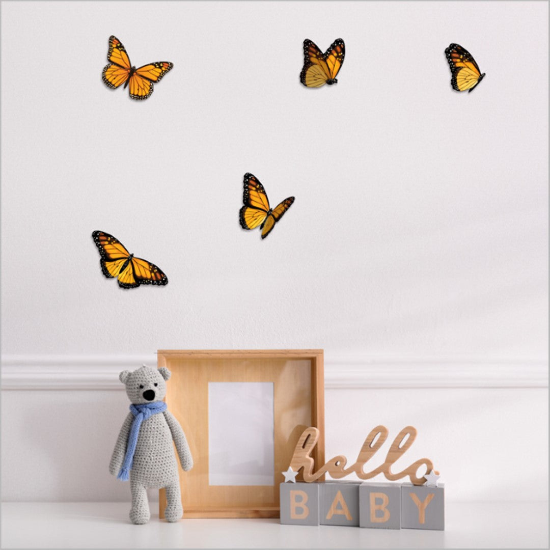 Vibrant laser-cut monarch butterflies on textured board, perfect for adding elegance to any living space.