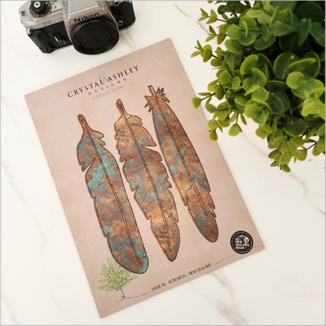 Copper patina feather wall art set from New Zealand, designed for easy mounting and creative display in any room.