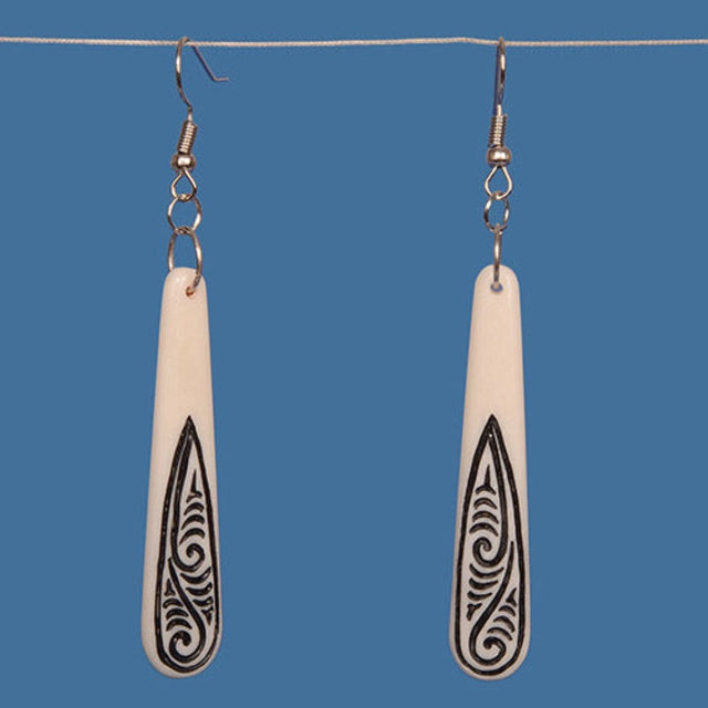 Bone drop earrings with black tribal patterns, elongated teardrop design, silver hooks, lightweight and elegant.