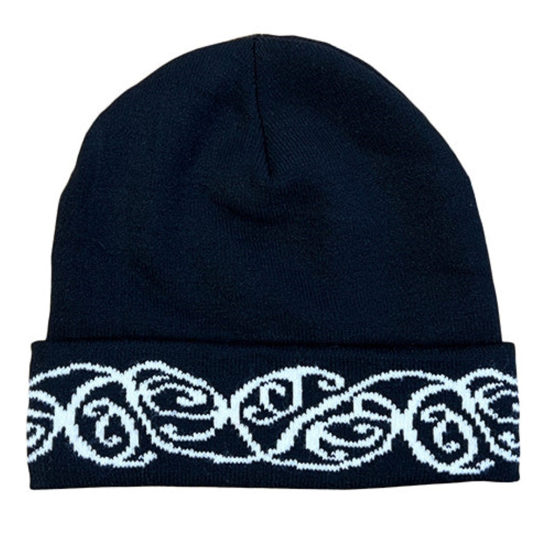 Black beanie featuring a bold white embroidered M?ori pattern, designed for warmth and style in cooler seasons.