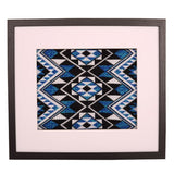 Framed art showcasing the Taniko Band Blue, a handcrafted tribute to Maori culture with symbolic patterns and modern appeal.