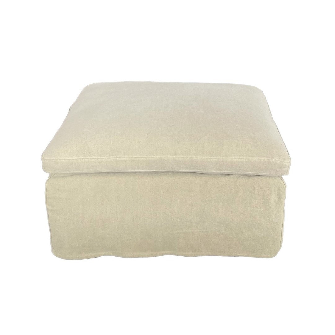 Hemp-colored Carlton Ottoman, plush upholstery, versatile for seating or footrest, enhancing contemporary living spaces.