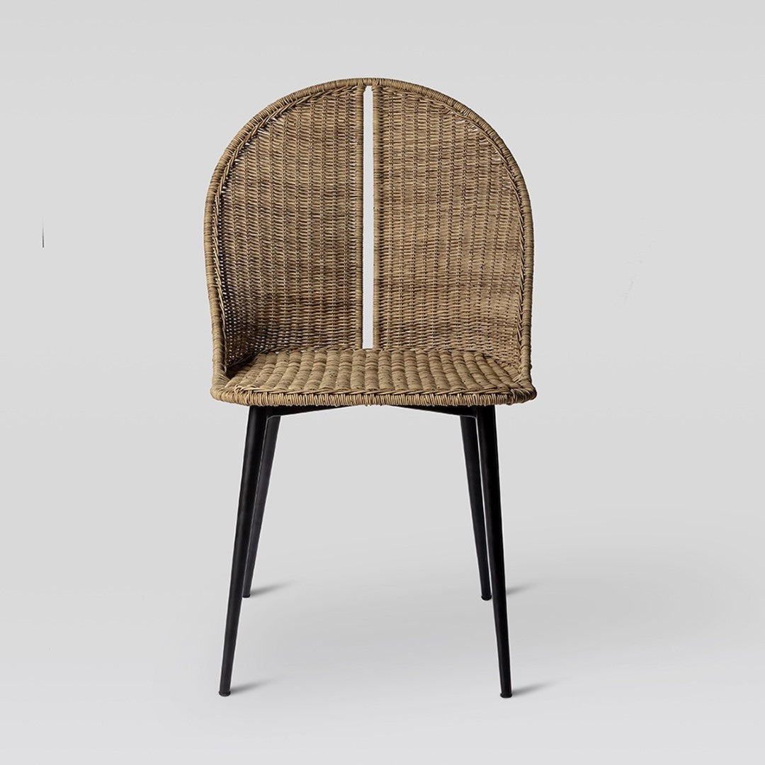 Natural rattan dining chair with intricate weave, sturdy metal frame, ergonomic design for comfort and style in any setting.