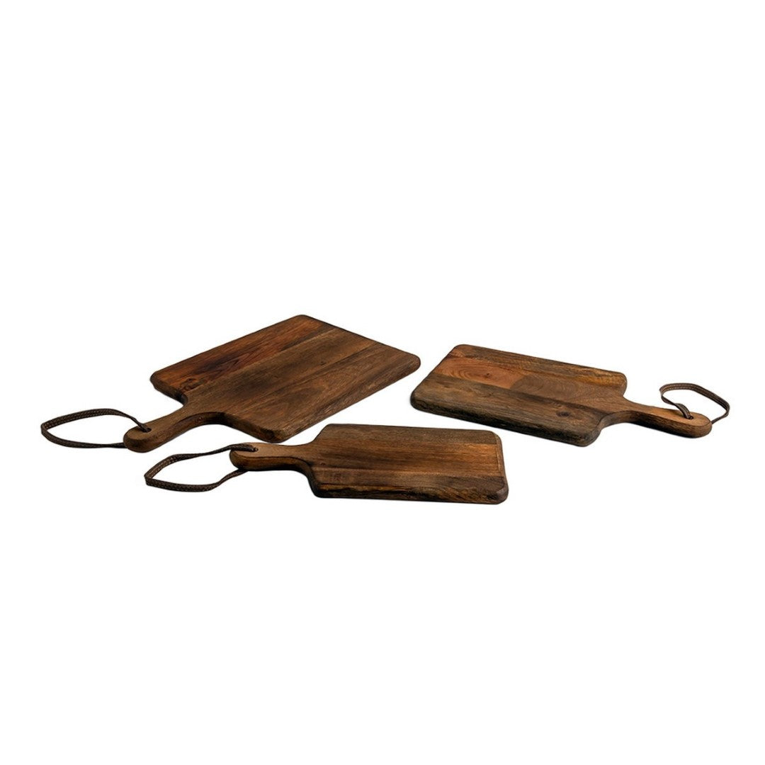 Set of 3 natural mango wood chopping boards in varying sizes for versatile food preparation and stylish kitchen decor.