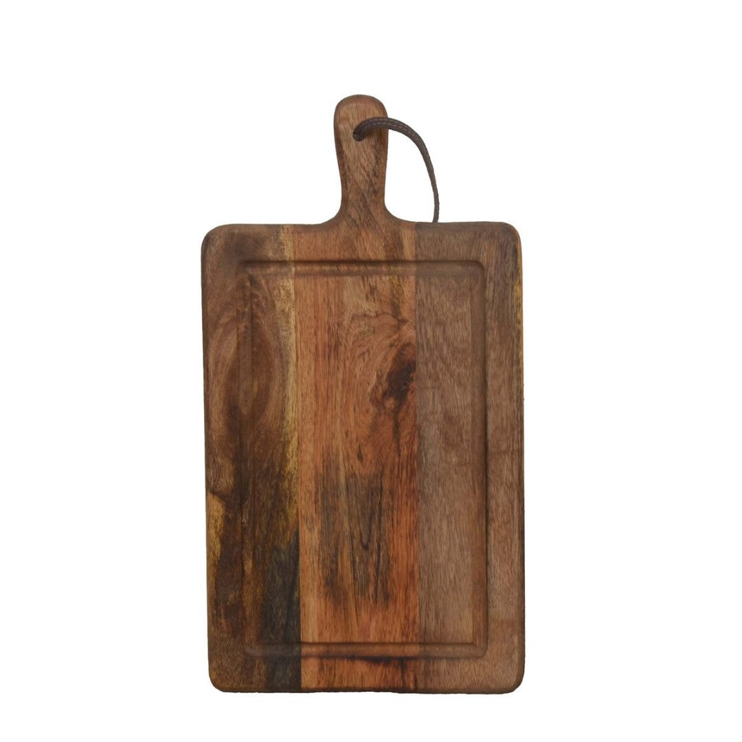 Natural mango wood chopping board (25x47cm) designed for stylish and practical food preparation in any kitchen.