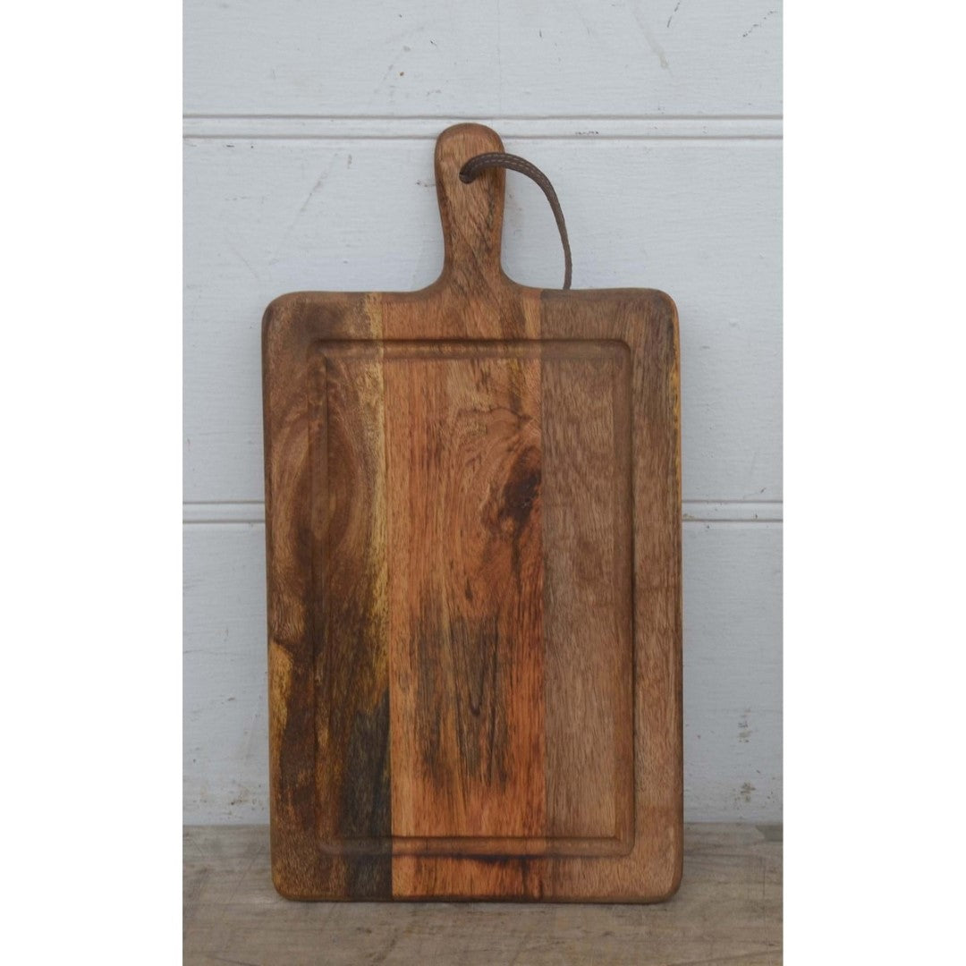 Natural mango wood chopping board (25x47cm) combines durability and style for versatile food preparation.