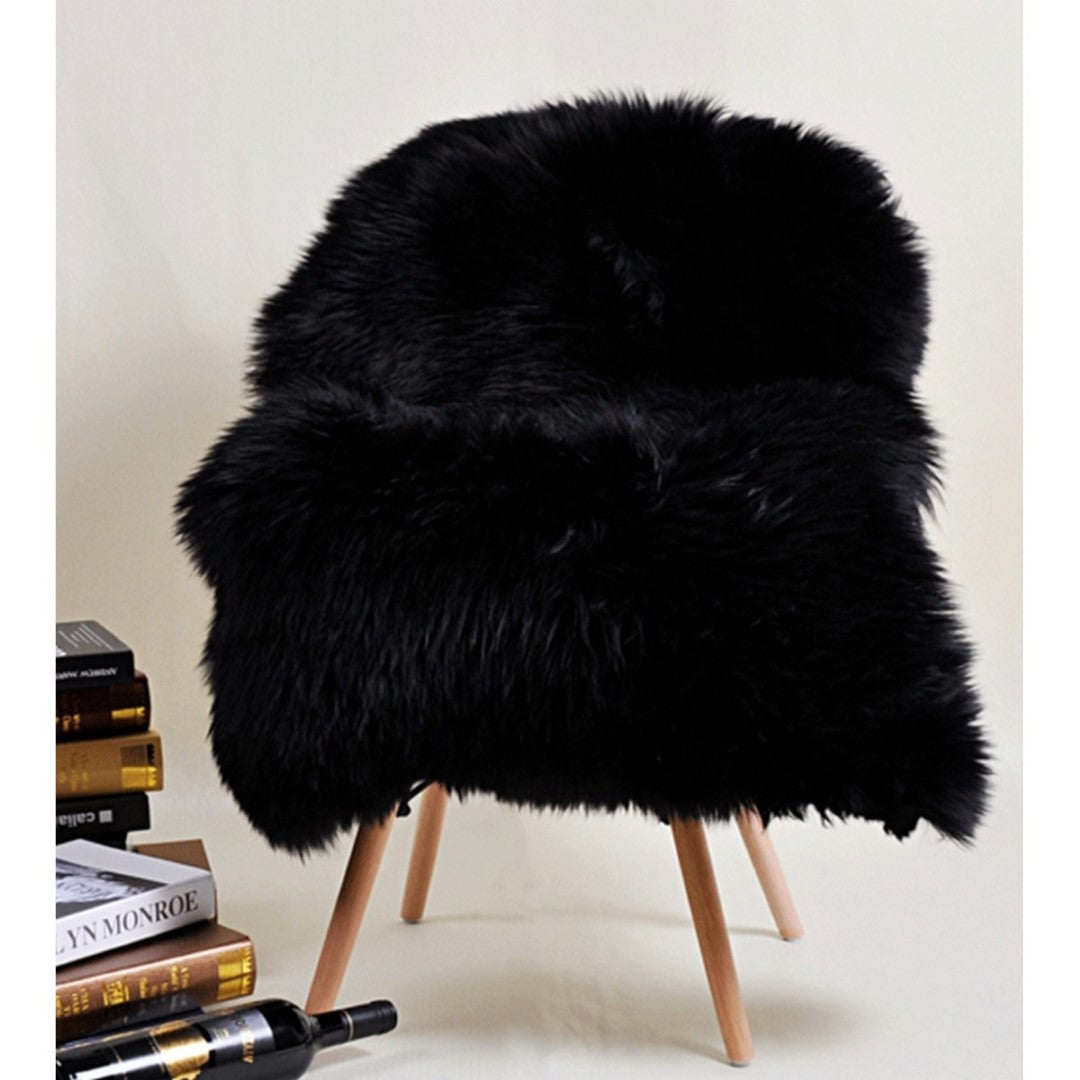 Luxurious black Kaikoura long wool sheepskin (60x90cm) offering softness and warmth for stylish home décor.