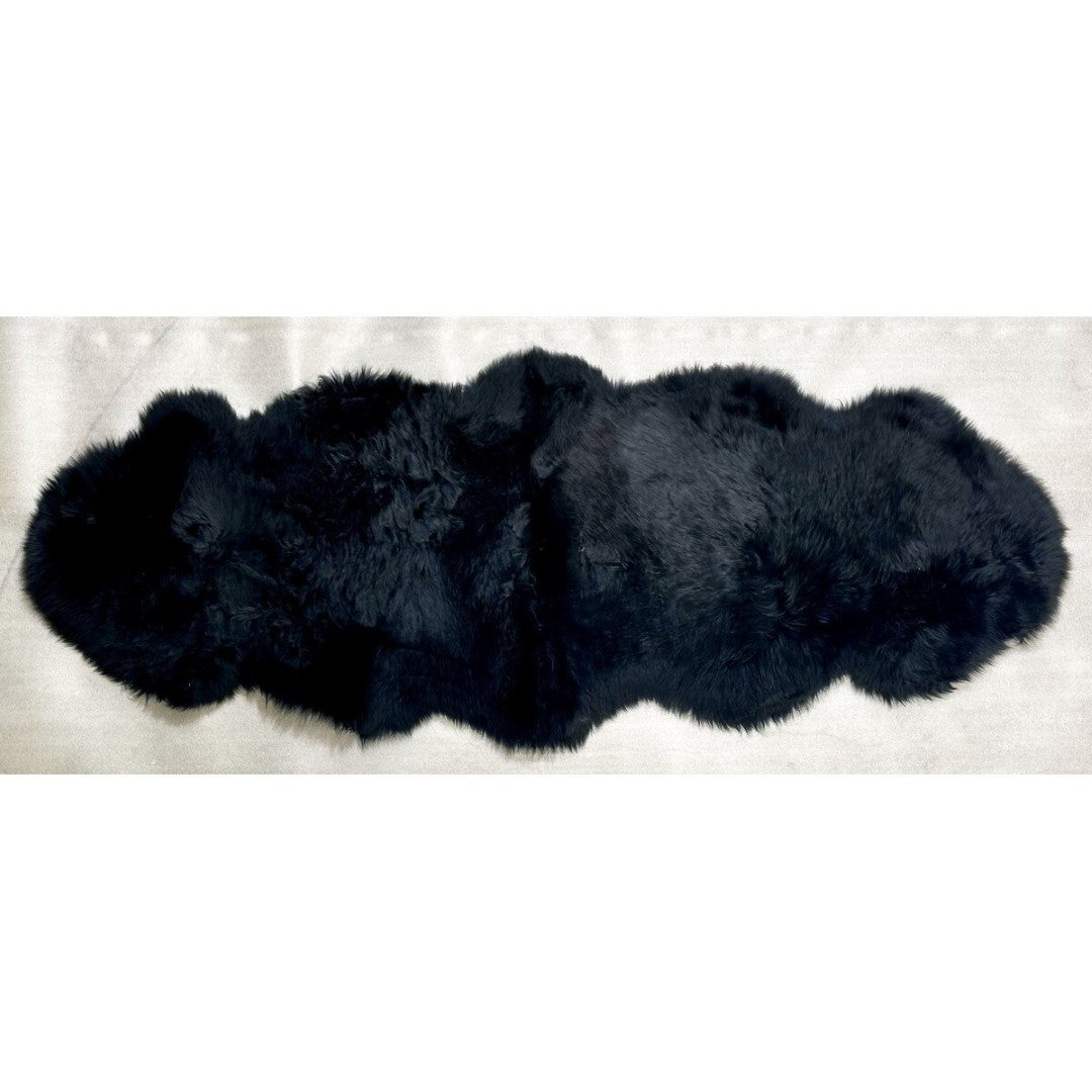 Kaikoura Long Wool Double NZ Sheepskin rug in black, measuring 60cm x 1.8m, offers luxury, warmth, and stylish comfort.