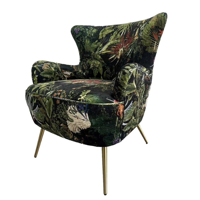 Botanical occasional chair featuring plush velvet upholstery, antique brass legs, and a vibrant nature-inspired print.