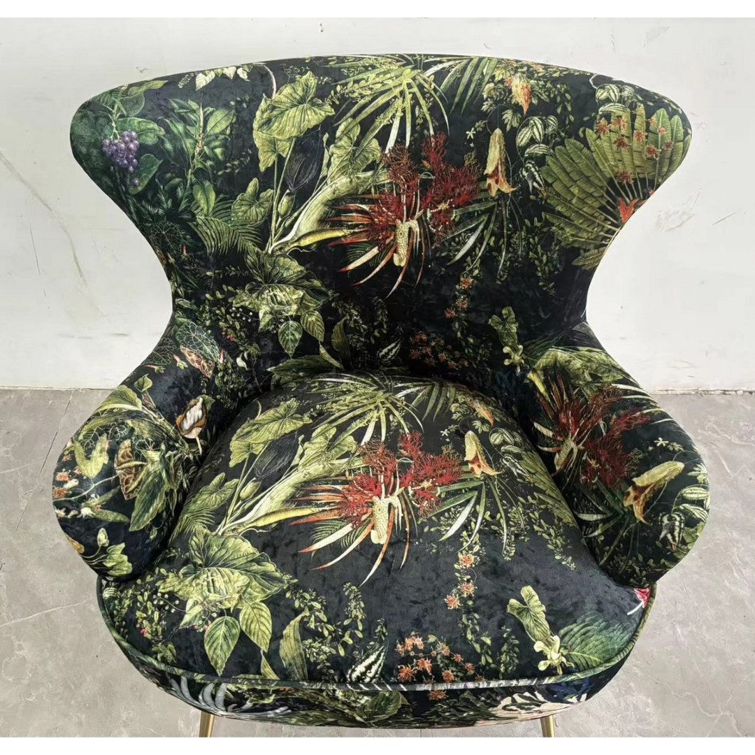 Botanical Occasional Chair with plush velvet upholstery, sturdy timber frame, and antique brass legs, featuring a nature-inspired print.