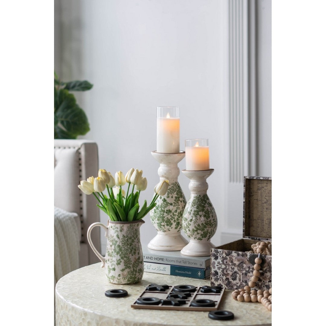 Large green and white ceramic candle holder with intricate flower details, perfect for creating a cozy home ambiance.