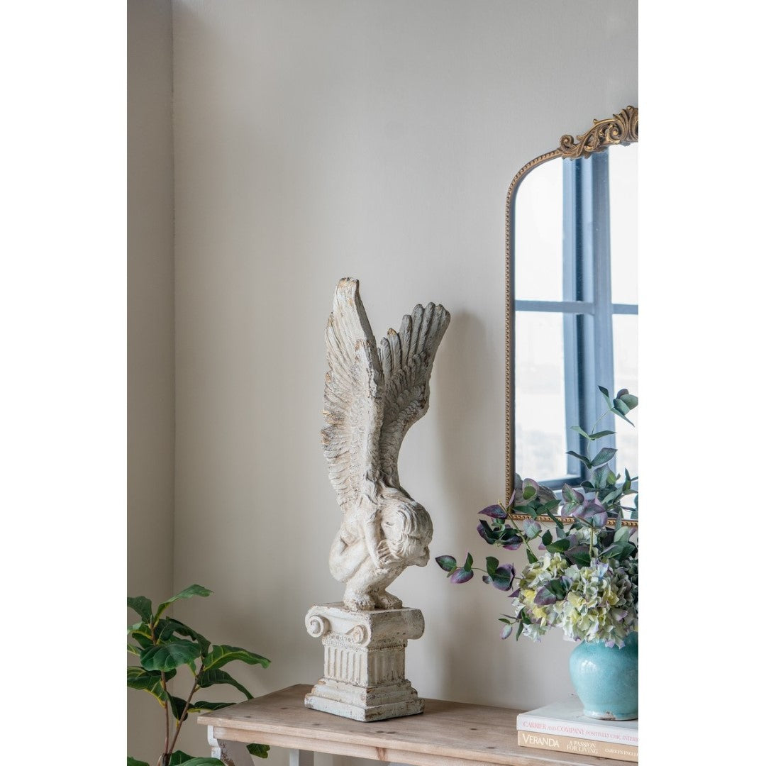 Elegant angel statue with intricate wings, perfect for enhancing outdoor decor and symbolizing tranquility and hope.