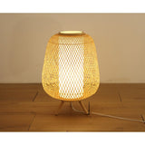 Elegant bamboo floor lamp standing 60 cm tall, providing warm light and organic charm for various interior styles.