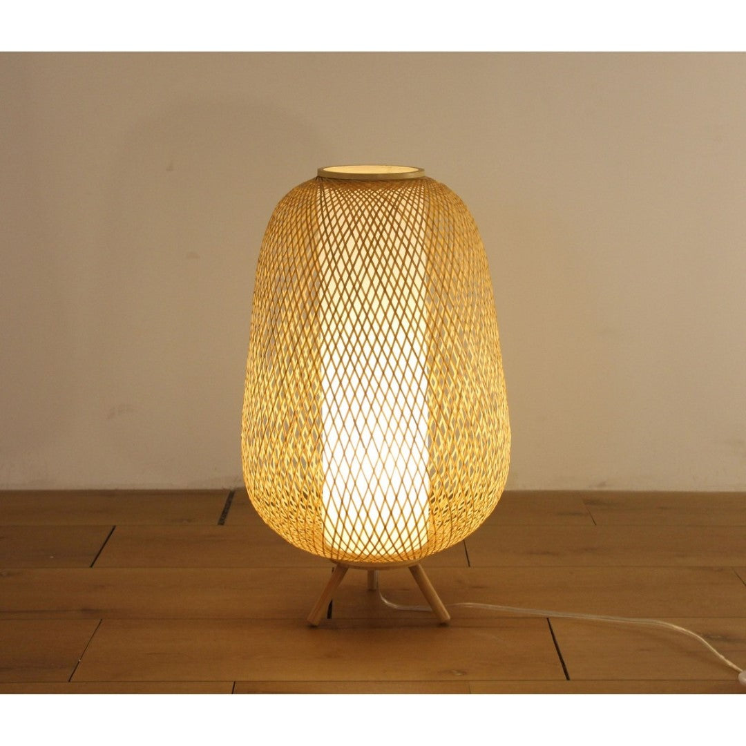 Eco-friendly bamboo floor lamp, 33x33x47 cm, offering warm light and stylish design for modern and bohemian interiors.