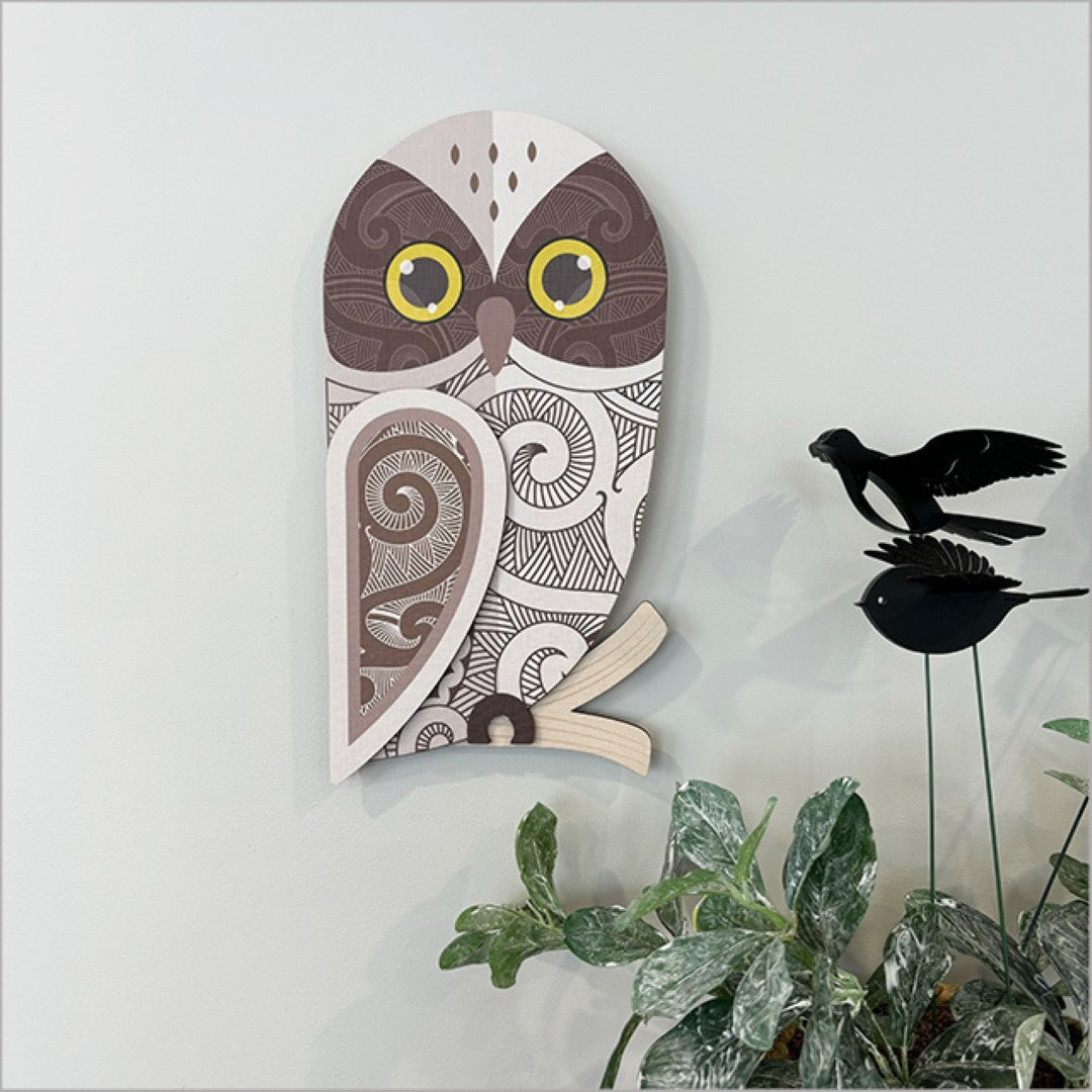 Wall art featuring intricately designed Ruru birds, bees, and butterflies on textured 3mm board, perfect for nature decor.