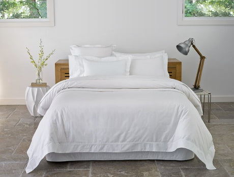 Crisp percale cotton duvet cover set with double stitching, ethically made in Portugal, ideal for a five-star home experience.