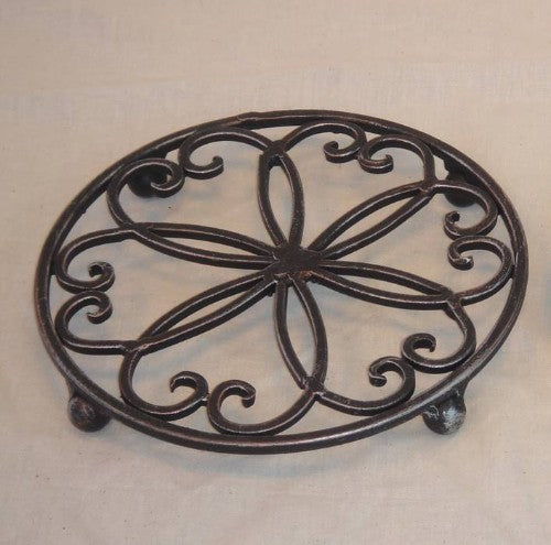 Elegant black trivet with silver and gold accents, measuring 20CM, protects surfaces while enhancing kitchen aesthetics.