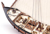 Detailed 1/65 scale model of La Niña featuring laser-cut parts, brass fittings, and hand-sewn sails for collectors and hobbyists.