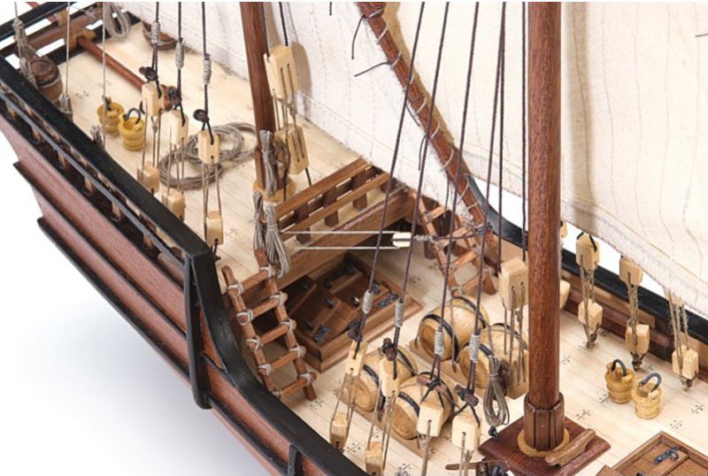 Detailed 1/65 scale model of La Niña Caravel, featuring laser-cut parts, brass fittings, and hand-sewn sails for enthusiasts.