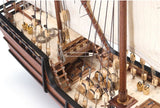 Detailed 1/65 scale model of La Niña Caravel, featuring laser-cut parts, brass fittings, and hand-sewn sails for enthusiasts.
