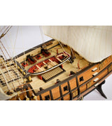 Detailed model kit of the 1/90 San Francisco II galleon, featuring laser-cut wood, cotton sails, and a display stand.