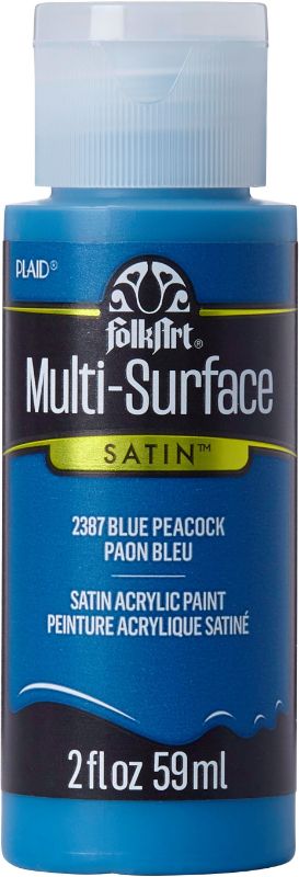 Folk Art Blue Peacock Acrylic Paint in 2oz bottle, versatile for various surfaces, offering smooth application and a satin finish.