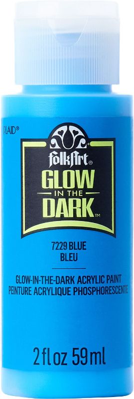 Bright blue Folk Art acrylic glow-in-the-dark paint in a 2oz bottle, ideal for creative DIY projects and art enhancements.