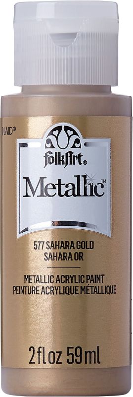 Folk Art Acrylic Metallic Paint in Sahara Gold, 2oz, offers a rich, shiny finish for various DIY projects and surfaces.