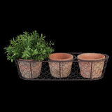 Rustic terracotta pots in a wire basket, perfect for indoor or outdoor plants, enhancing decor with Tuscan elegance.