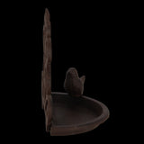 Cast iron wall bird feeder (18 x 10 x 19cm) with open design for easy access, enhances garden decor while attracting birds.