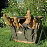 Garden Tool Stool with removable tool bag and spacious compartments, perfect for sitting and storing gardening essentials.