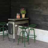 Green Tractor Bar Stool featuring vintage design, height adjustment, sturdy metal construction, and built-in footrest for comfort.