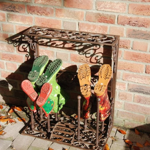 Cast iron boot rack with scraper, holds four pairs, perfect for indoor/outdoor use, 34 x 63 x 78cm, stylish and durable design.