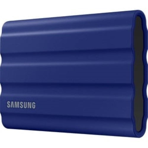 Samsung T7 Shield 1TB Portable SSD in blue, featuring 1050 MB/s read speed, AES encryption, and rugged, water-resistant design.