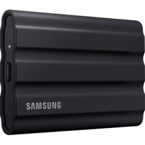 Portable Samsung T7 Shield 4TB SSD in black, rugged design with IP65 rating, fast 1050 MB/s read speed, ideal for outdoors.