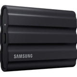 Portable Samsung T7 Shield 4TB SSD in black, rugged design with IP65 rating, fast 1050 MB/s read speed, ideal for outdoors.