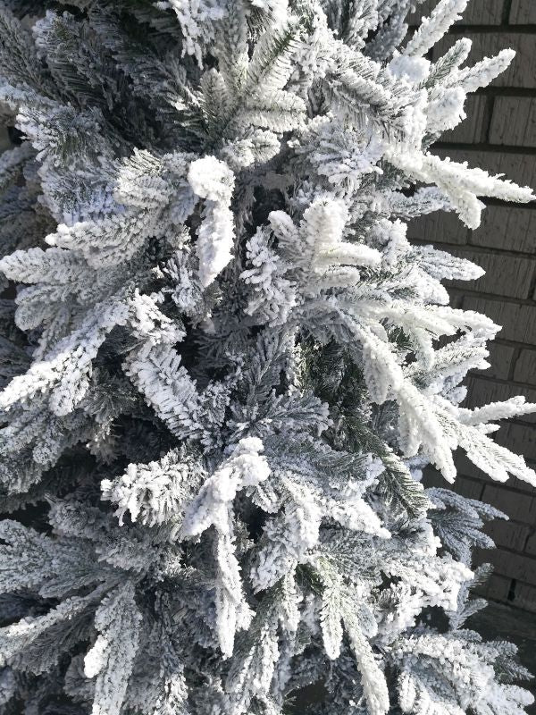 6.5-foot mixed pine snowy Christmas tree with realistic snow-dusted needles, perfect for festive home decor.