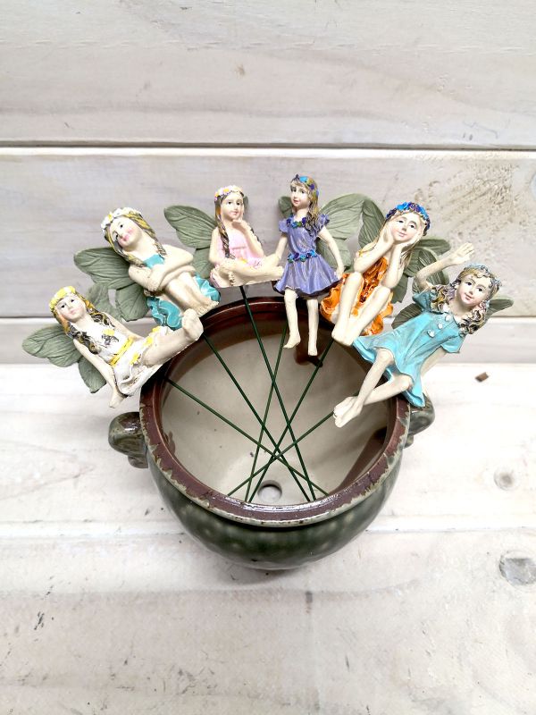 A set of 6 decorative fairy picks with intricate designs, perfect for gardens, parties, and festive occasions.