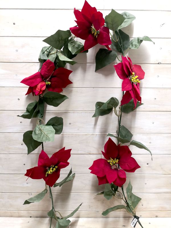Vibrant red artificial poinsettia garland, perfect for festive holiday decor and year-round displays. Durable and low maintenance.