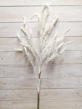 Artificial white caterpillar grass spray, lifelike and maintenance-free, perfect for home decor and low-light spaces.