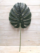 Lifelike 34*30cm artificial Monstera leaf, perfect for enhancing decor with maintenance-free tropical greenery.