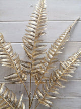 Lifelike 100cm gold fern sprays, perfect for adding elegance to any decor without maintenance in low-light settings.