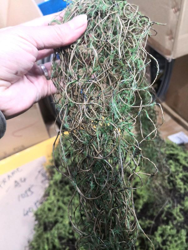 Lifelike 125cm brown twig bundle with moss, perfect for enhancing home decor without maintenance.