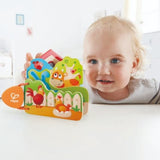 Hape Wooden Baby's Farm Animal Book with vibrant illustrations, safe for infants to chew, promoting early literacy and fun.