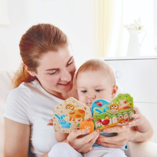 Colorful wooden farm animal book for babies, featuring safe chewable pages and engaging illustrations for early reading.