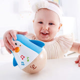 Colorful Hape Penguin Musical Wobbler Toy with soothing sounds, encouraging interactive play and development for infants and toddlers.