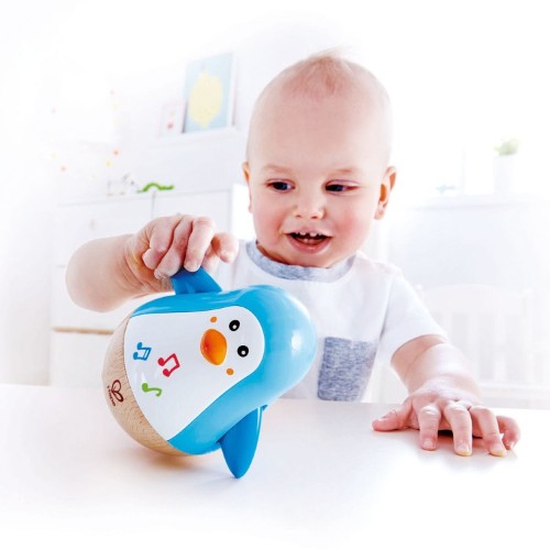 Colorful Hape Penguin Musical Wobbler Toy with soothing sounds and waddle, promoting motor skills and interactive play for toddlers.