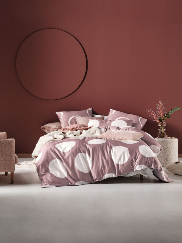 Super King Duvet Cover Set by Savona featuring soft neutrals, dusky pinks, and a circular tie-dye design in luxurious cotton sateen.